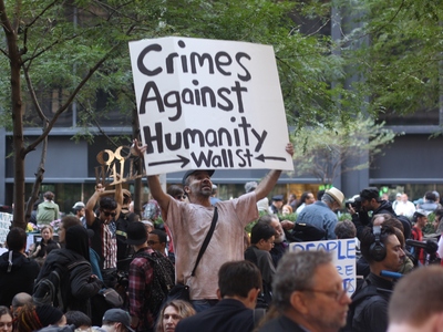 Occupy Wall Street 
ที่มาภาพ: http://www.ultragod.com/Occupy_Wall-Street_Crimes_against_humanity.jpg